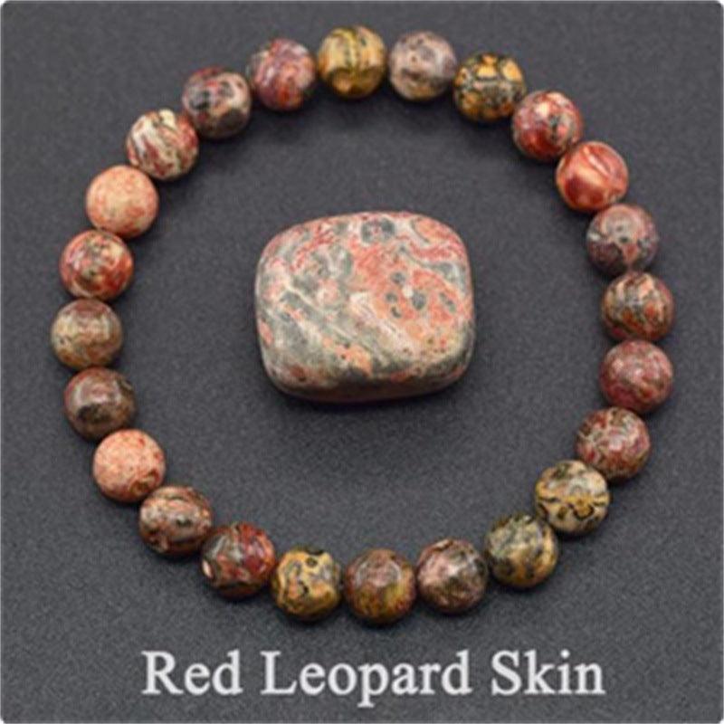 Detailed view of the Red Leopard Skin bracelet, showcasing the intense red base with contrasting black and gray patterns, embodying nature's fierce beauty.